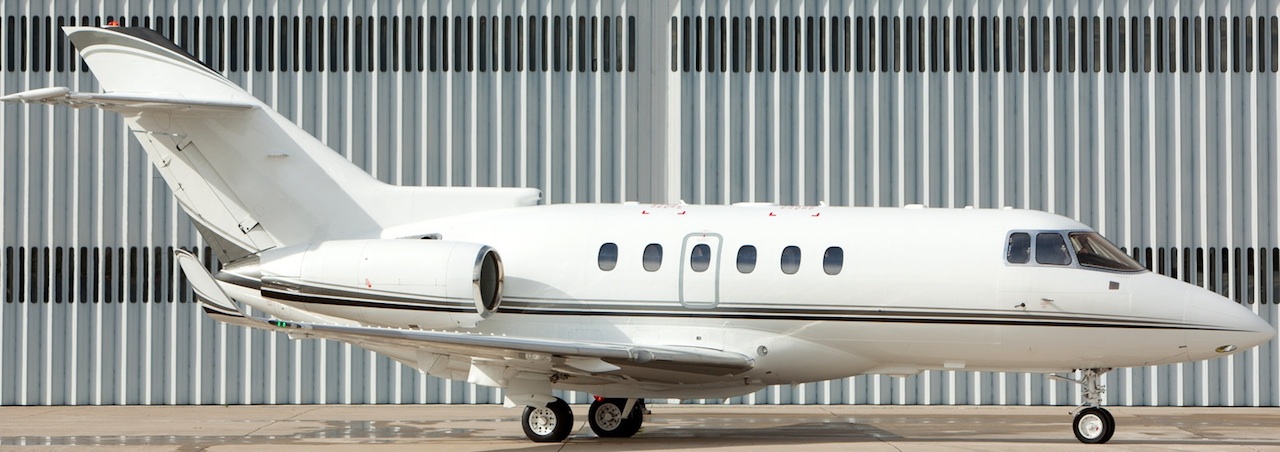 business-jet-parked-in-front-of-hangar–m