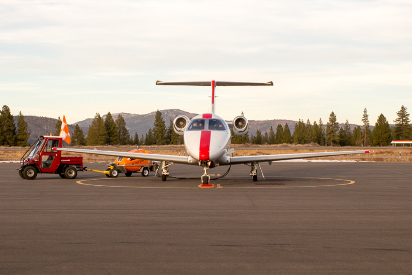 JetSuite Plane at Truckee Airport. JetSuite is one of several companies offering semi-commercial plane travel to Truckee for affluent travelers who seem unconcerned about the damage private jets do to the quality of life of local residents and the environment.